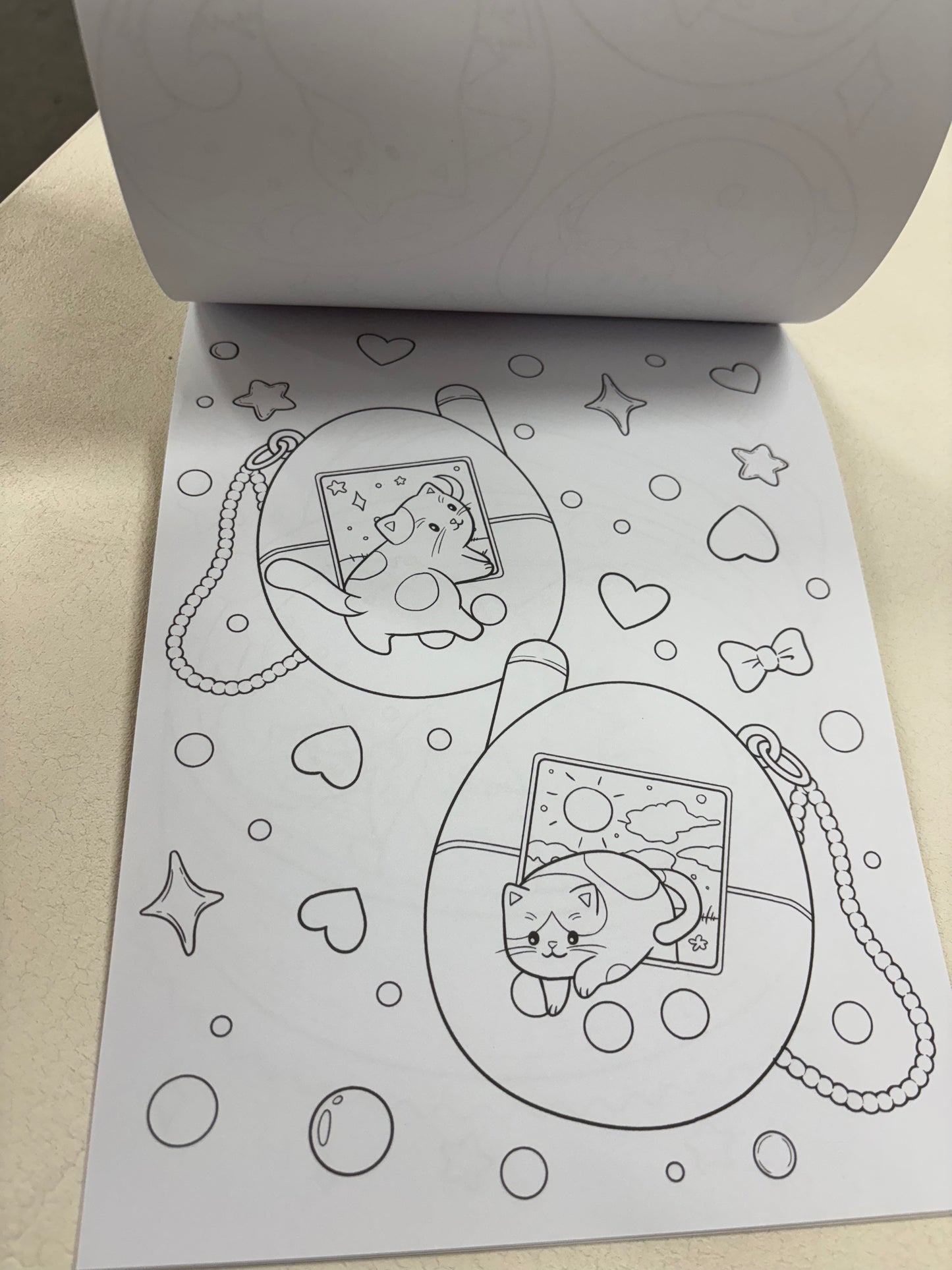 Tiny cats colouring book